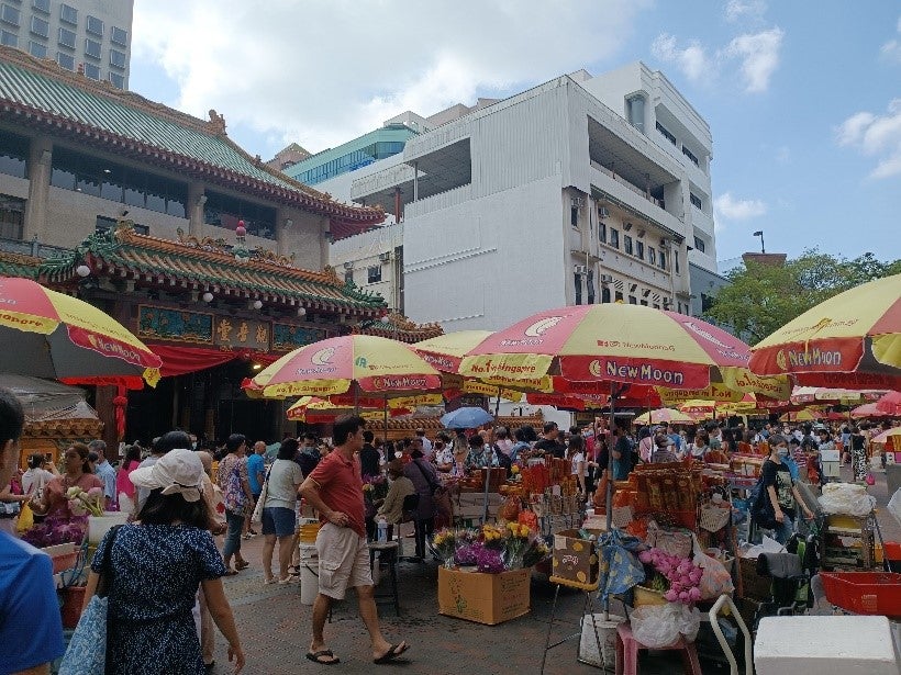 Picture: Joss stick and flower vendors at the entrance of Kwan Im Thong